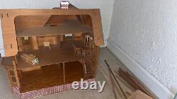 Large wooden dollhouse. 28H x 30W x 28D. Built from a Kit