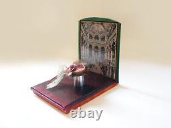 Miniature items, hat, base, umbrella, shawl, framed picture on the wood frame