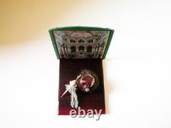 Miniature items, hat, base, umbrella, shawl, framed picture on the wood frame